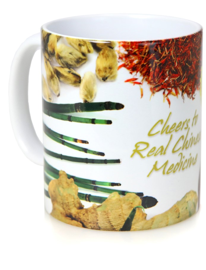 Mug printed with herbs and the phrase "Cheers to Real Chinese Medicine" - left side