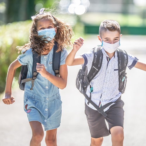 Photo of kids running to school