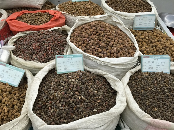 bags of chinese herbs at a market